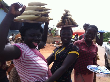 Some lovely ladies who work at the toll between Kumasi and Konongo. Corn [maize] is in season! Fast food...Ghana style.